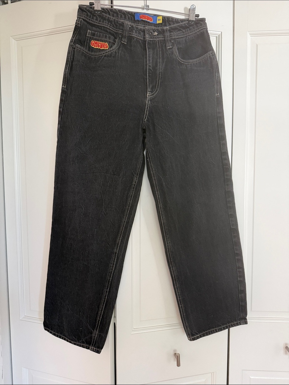 Empyre Black Jeans with Blue & Yellow Brand Tag